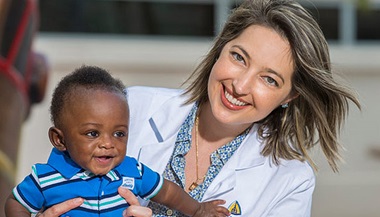 Baby Jauhe'y with Joan Machry, M.D. outside of Johns Hopkins All Children's Hospital. 