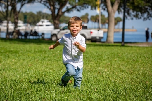 Jayce running and smiling