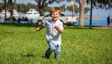 Jayce running and smiling