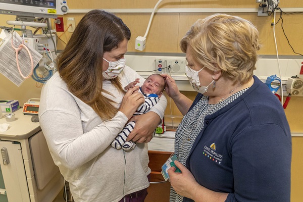 John-Derrick and his mother Anna with nurse practitioner Carolyn Kelly, APRN. The family and Kelly formed a special bond after learning they were all from the same town in Newfoundland, in Canada.