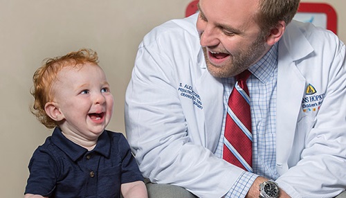 Little kid smiling with Doctor