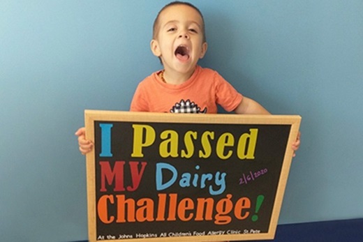 Nico celebrating completing an oral food challenge at Johns Hopkins All Children's