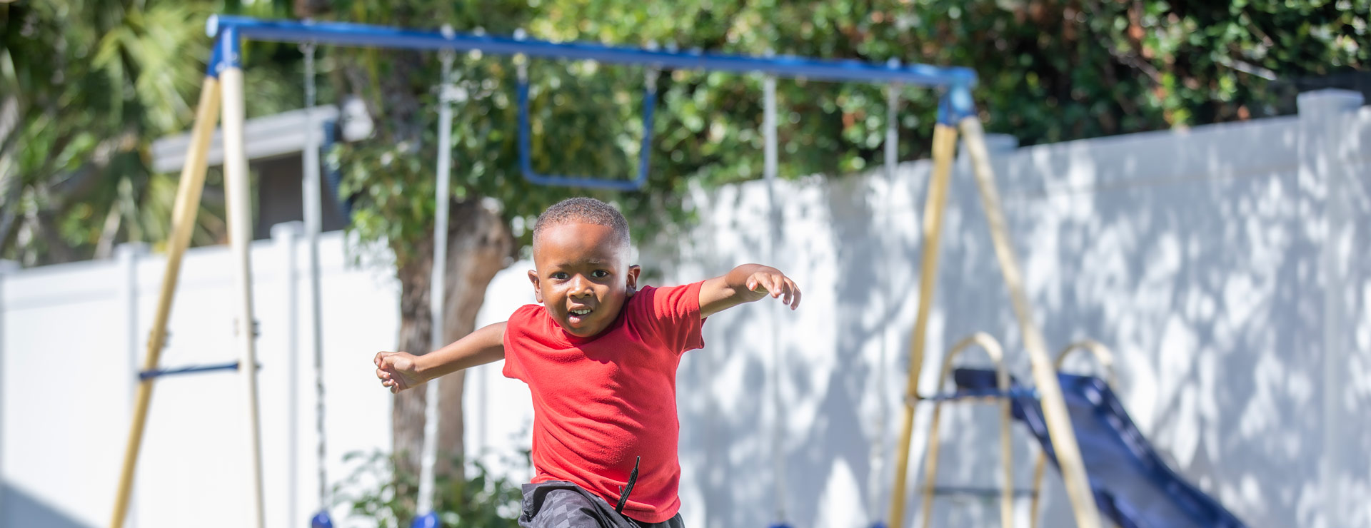 Erik playing soccer in his yard