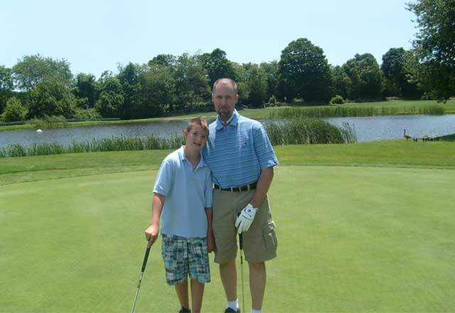 Steve golfing with his son