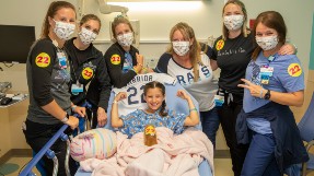 Chloe, a patient at Johns Hopkins All Children's Hospital, pictured with her treatment team.
