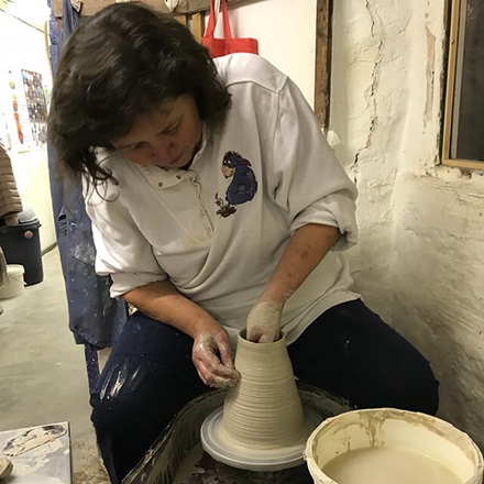 Vivienne making pottery