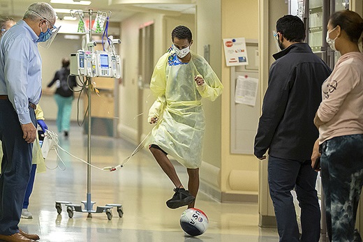 A few days after surgery, Wilfre was passing a soccer ball in the hallway with his care team at Johns Hopkins All Children's.