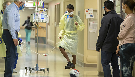 A few days after surgery, Wilfre was passing a soccer ball in the hallway with his care team at Johns Hopkins All Children's.
