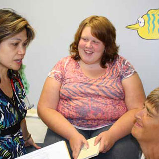 Pediatrician Maria Sofia Avendano-Welch with 12-year-old Hailee Smith and her mom, Trudy
