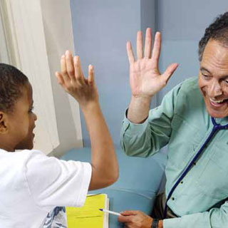 pediatrician Dan Levy with young patient