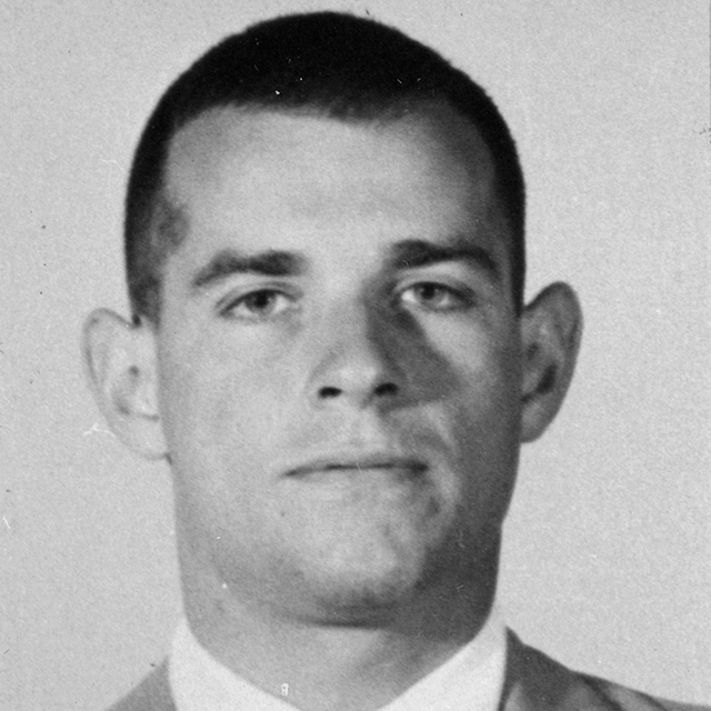 A photo shows Tom Powell.