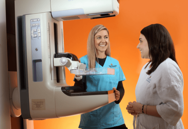 Providers preparing to perform a mammogram breast exam procedure