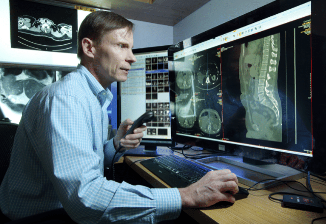 radiologist in front of computer