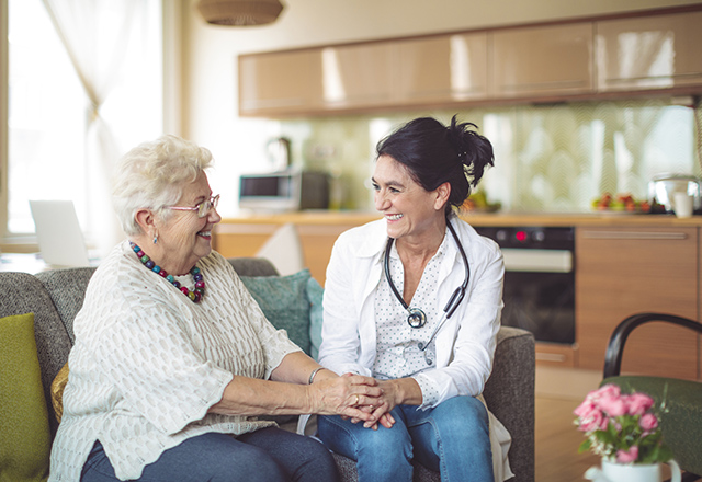 Smiling woman with nurse