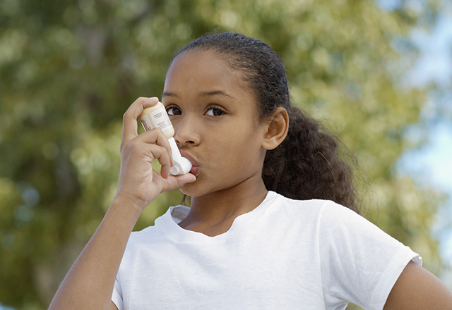 Girl uses inhaler