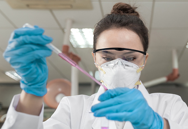 Researcher fills test tubes