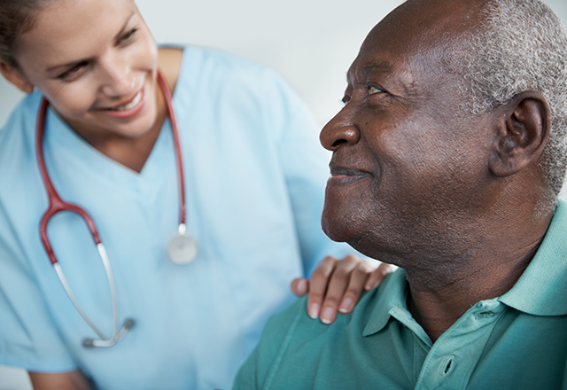 Man smiles at nurse