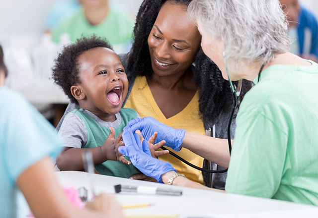 Smiling baby is happy at doctor's