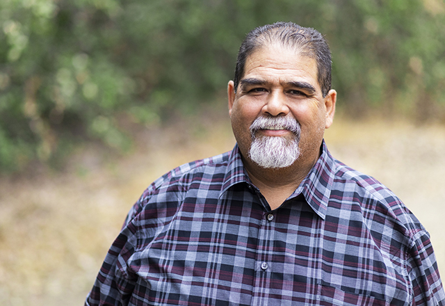 Man smiles at camera