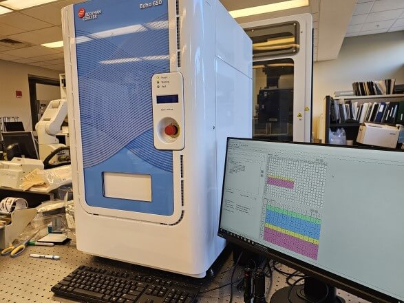 Acoustic liquid handler in a laboratory