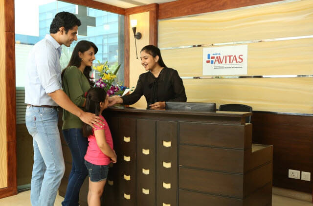 Family checking into a healthcare facility.
