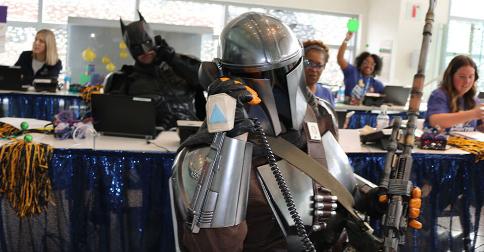 mandalorian and batman volunteering at radiothon