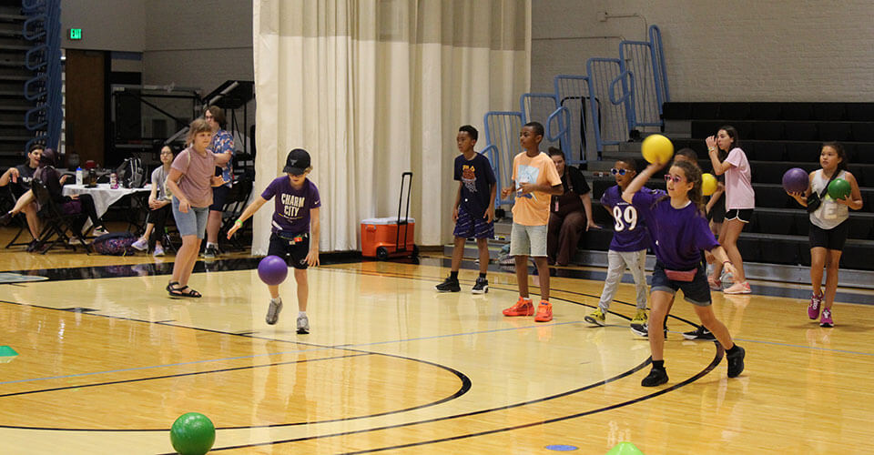 kids playing dodge ball at camp charm city