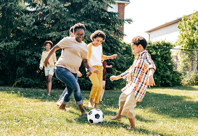 a family plays soccer together