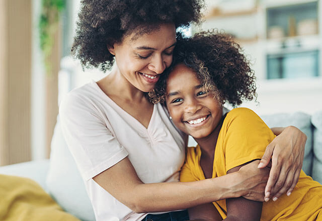 a daughter hugs her mother