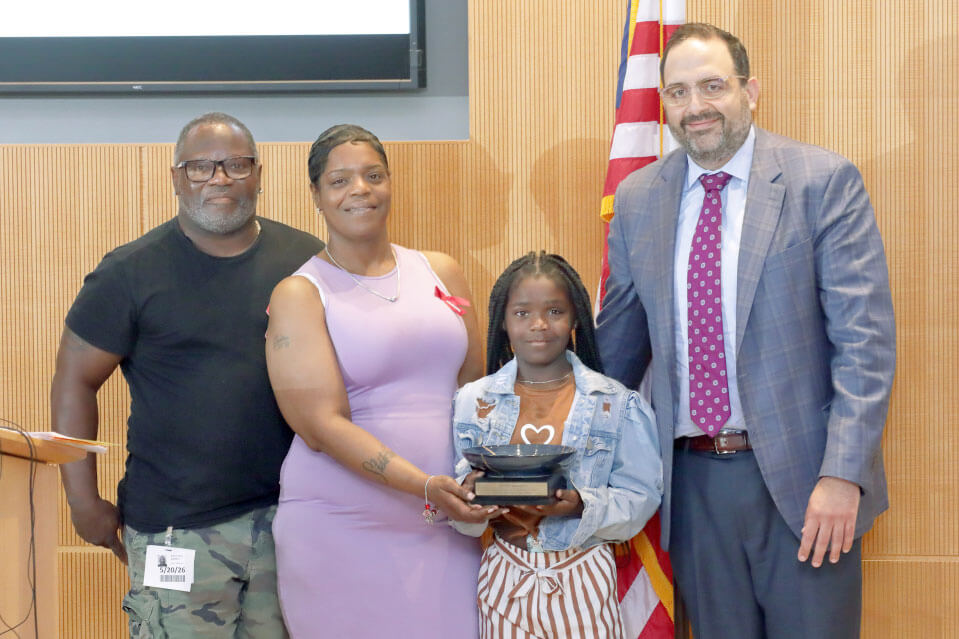 Janyla Brown with family and Dr. Isam Nasr