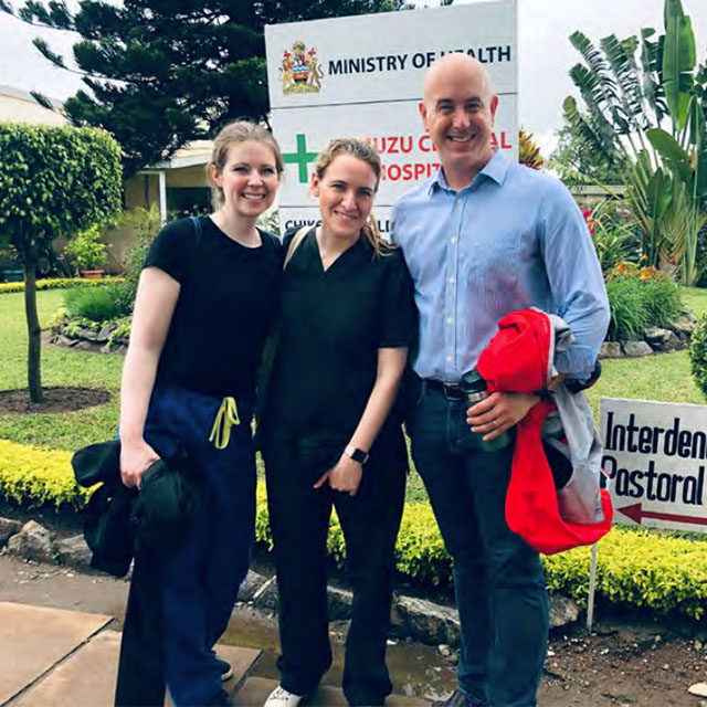 Eric McCollum with physicians Brittany Hunter, left, and Chiara Bertolaso at Kamuzu Central Hospital in Lilongwe, Malawi