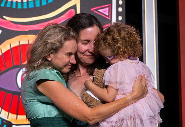 Courtney Kraus with Maggie Cowell holding her daughter, Bernie