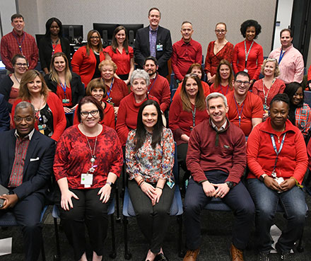 employees of hopkins wearing red