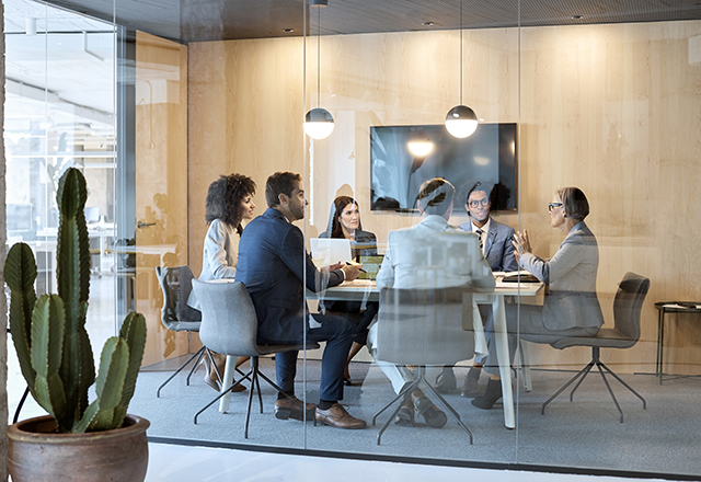 men and women in conference room