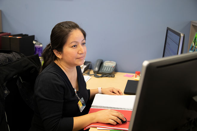 woman sitting looking at the computer screen