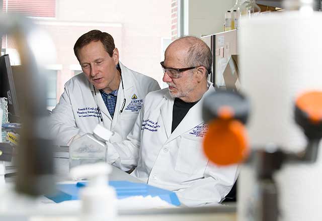 Dr. Bert Vogelstein with Scientist in lab