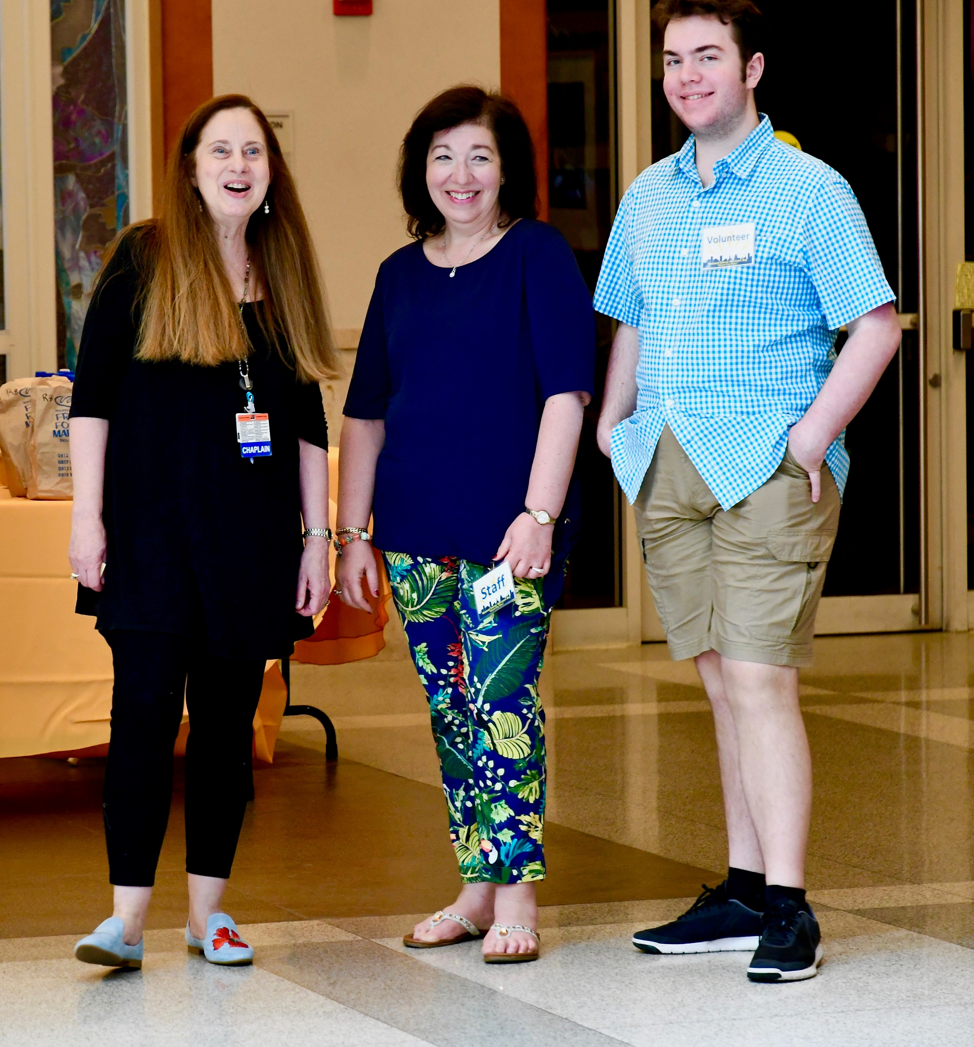 Patient & Family Services Staff members with a volunteer