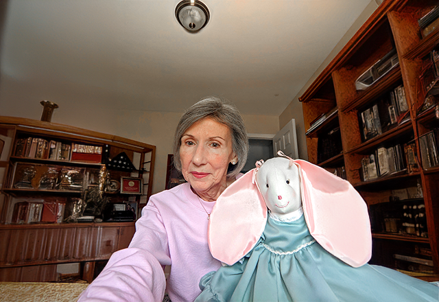 Kathleen holding a stuffed rabbit.