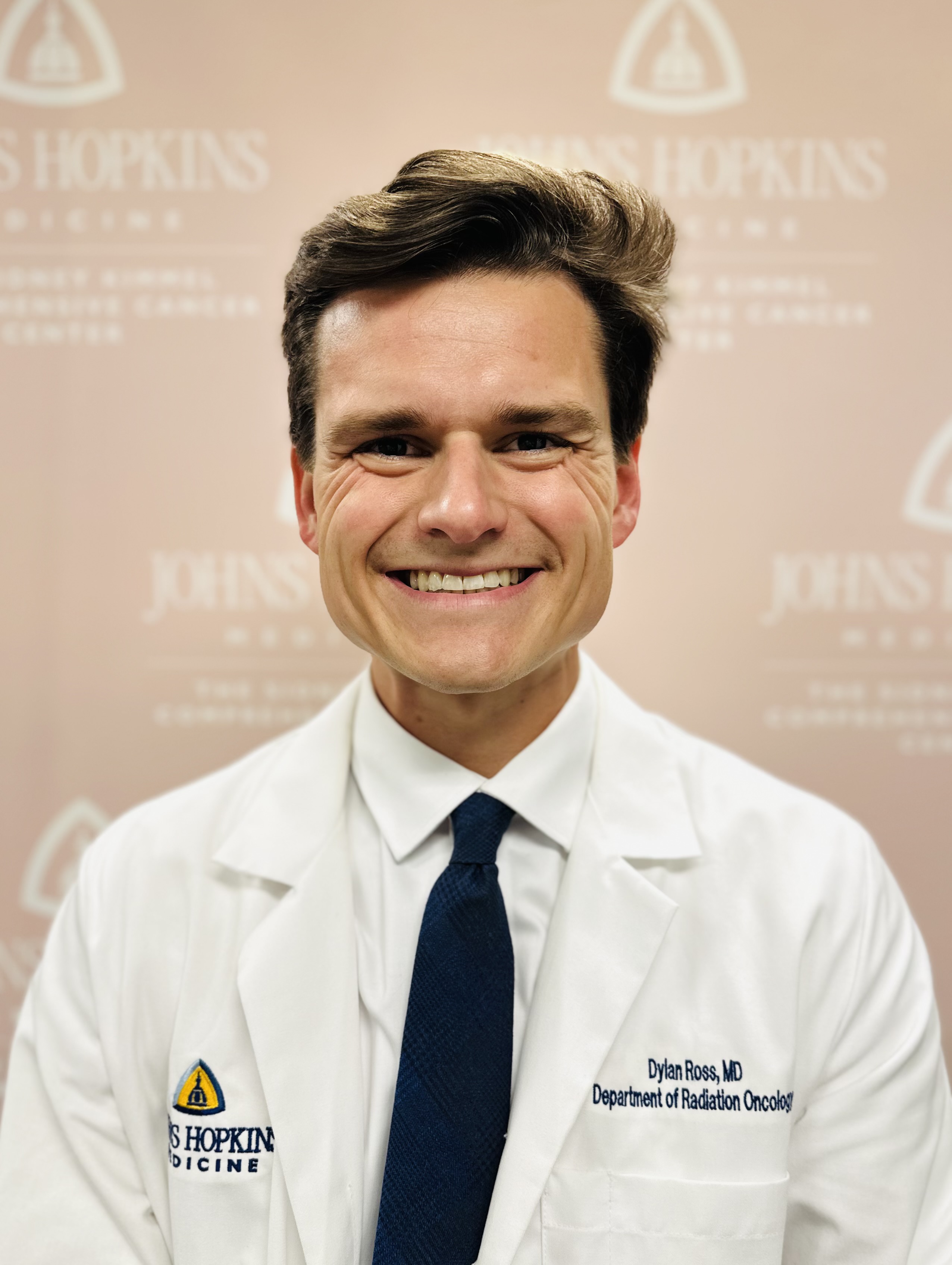 Photo of Dylan Ross, in a JHH whitecoat