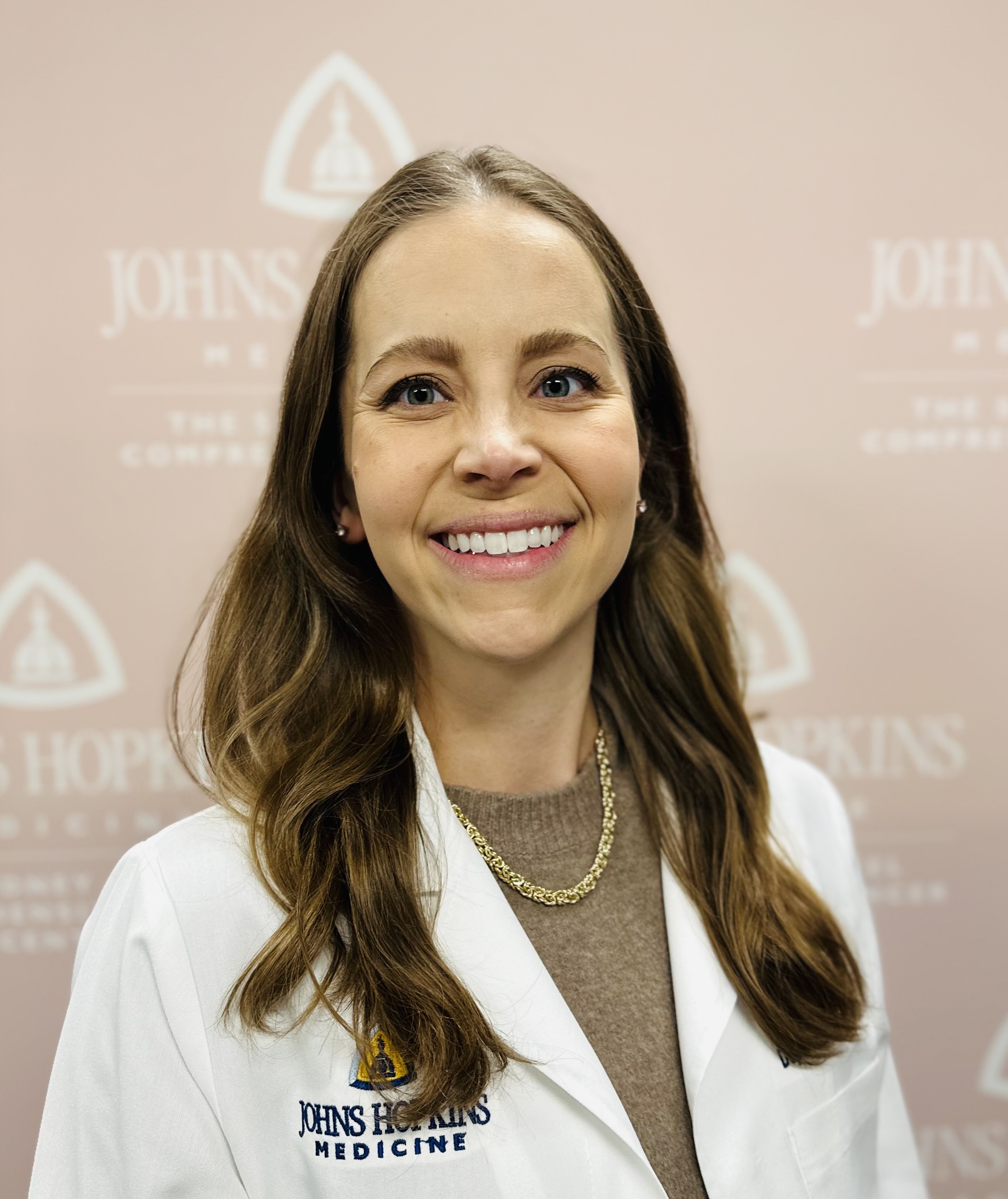 Photo of Emily Vonderhaar in a JHH whitecoat