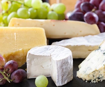 Platter of assorted cheeses, which contain lactose.