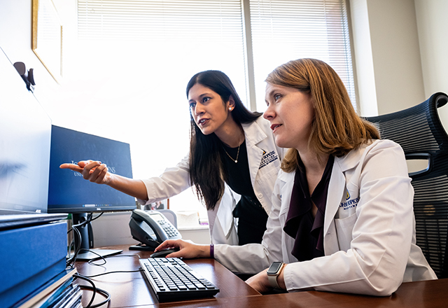 doctors looking at a computer
