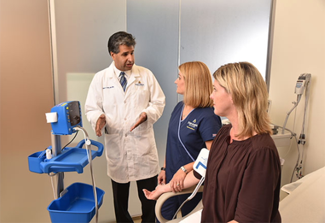 A doctor, a nurse, and a patient during an exam