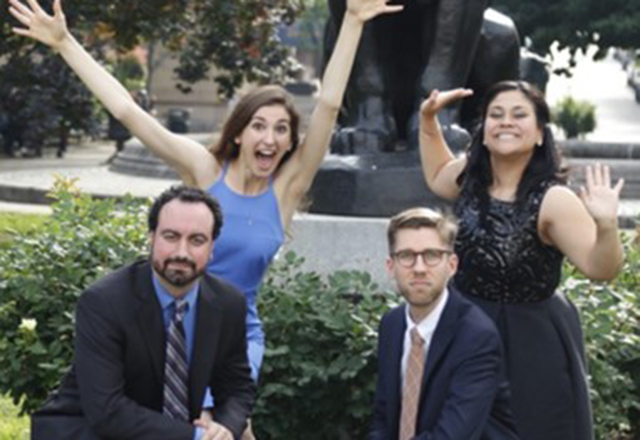 A group of residents strike silly poses together.