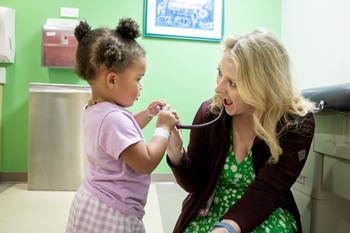 Resident with an infant patient