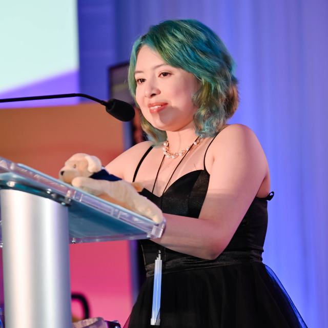 Girl Speaking at Podium