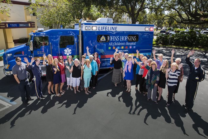 Guild members in front of the Johns Hopkins All Children's LifeLine ambulance, part of a $1.3 million pledge