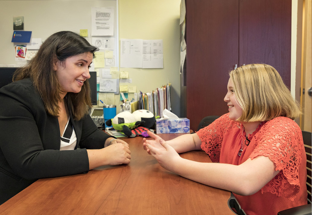 Jennifer Katzenstein, Ph.D., director of psychology and neuropsychology at Johns Hopkins All Children’s Hospital, with a patient.