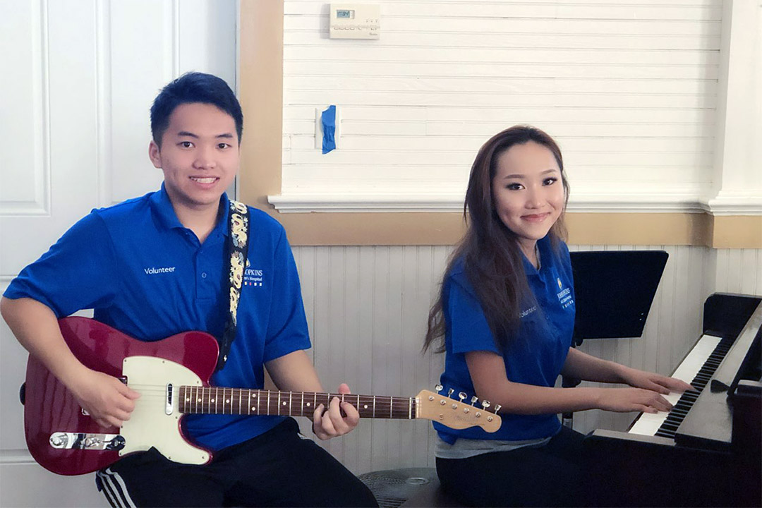 Madison and Maximus Xiong are brother and sister music volunteers at Johns Hopkins All Children’s Hospital