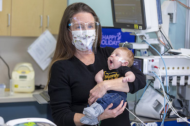 Stacey Stone, M.D., with Waylon, who is going home from the CDH unit.